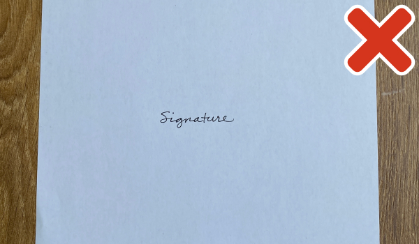 Incorrect signature image: table showing behind paper